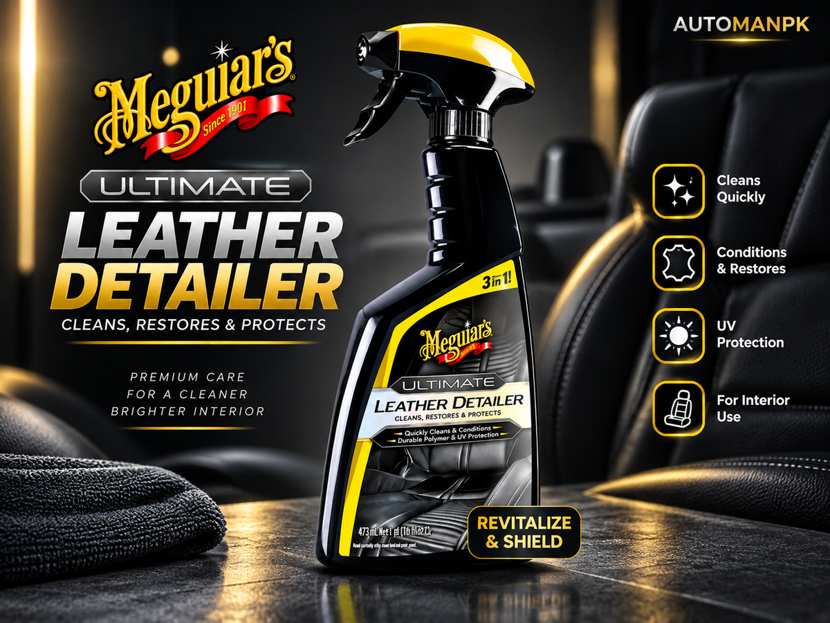 Meguar's Ultimate Leather Detailer spray bottle displayed on a dark car interior surface with a black leather seat in the background. The bottle is black with yellow and white labeling and a yellow spray top.