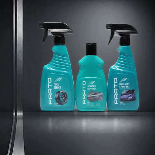 Three bottles of Prato car care products on a reflective surface with a dark background